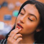 woman holding her lower jaw concerned with gingivitis